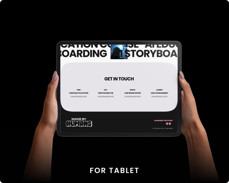 Hands holding a tablet displaying the Made by Humans contact page listing key team members including the CEO, Creative Director, Chief Brand Officer, and Head of Engagement, with the site footer on a dark background